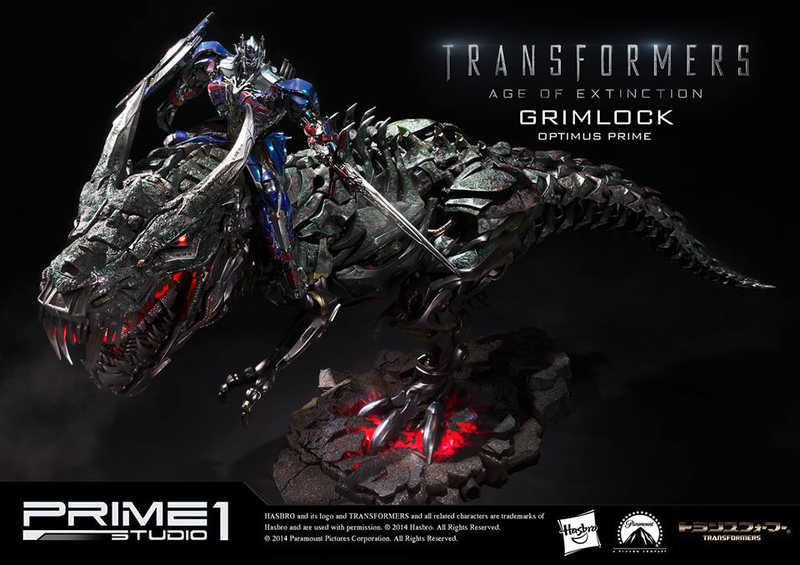 Illustration for article titled Glorious Grimlock and Optimus Prime Statue